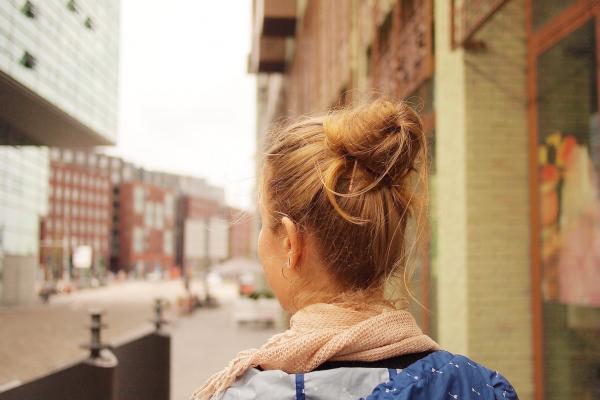 A girl walks through Amsterdam.