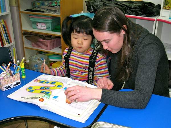 Allison with one of her young students. 