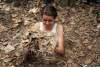 Judi enters the Cu Chi tunnels in Vietnam.